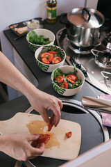Person preparing a salad in the caravan kitchen
