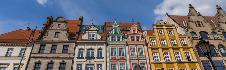 Fototapeta na wymiar Low angle view of old buildings on Market Square in Wroclaw, banner