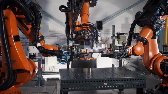 Robotic arm working in modern automobile factory.