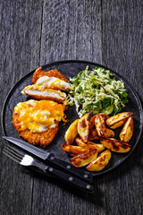 chicken parmo with coleslaw and roast potatoes