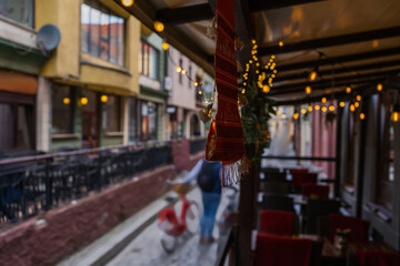 Garlands on blurred outdoor cafe on urban street in Wroclaw