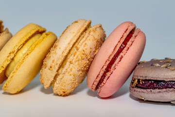 Row of delicious colorful French macaroons of different flavors, background, panoramic shot. High quality photo
