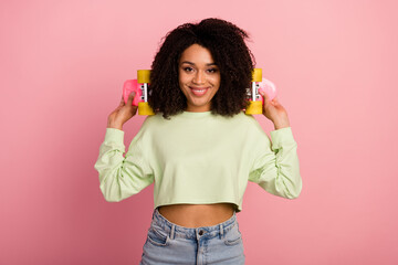 Photo of young lovely sportive girl good mood hold skateboard wear casual clothes isolated over pink color background