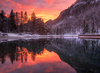 Vivid sunset reflections at Zavrsnica lake in Slovenia
