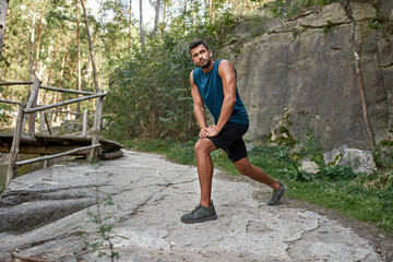 Sportsman warming up and looking away outdoors