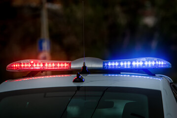 Police car lights on blurred background
