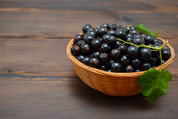 blackcurrant in a basket on the table close-up