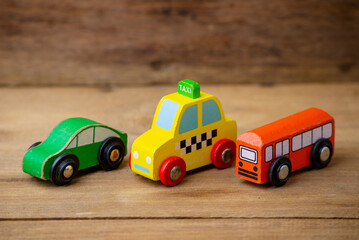 children toy, taxi , cars, school bus, isolated on wooden background