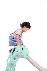 Little girl having fun on slide isolated on white