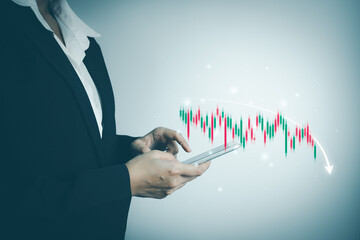 Investor analyze stock chart by smartphone,Businesswoman forecast graph in Bearish...