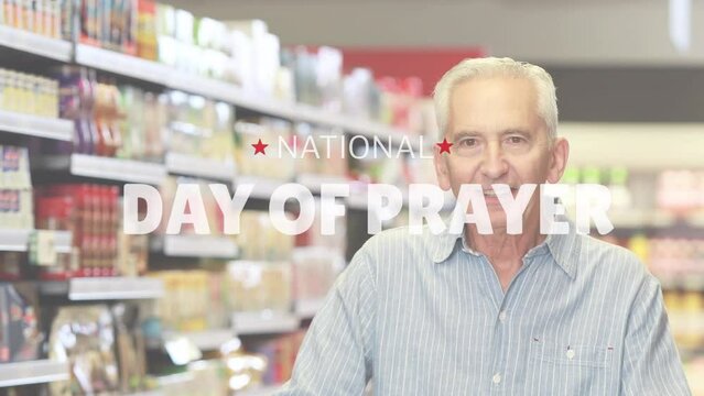 Animation of national day of prayer over senior men in the store