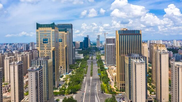 Aerial Hyperlapse of Haikou City CBD Landmark Buildings and Guoxing Avenue, Urban Landscape in Sunny Day, Hainan Province, the Largest Free Trade Zone in China.