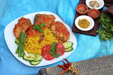 Fried fish in tomato sauce with basmati rice. Indian food