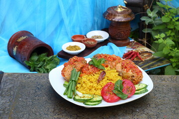Fried fish in tomato sauce with basmati rice. Indian food