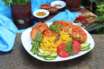 Fried fish in tomato sauce with basmati rice. Indian food