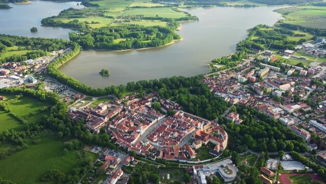 Aerial view of a large muddy pond near the historic town of Trebon surrounded by protected landscape area (beautiful nature) and rich fauna and flora. South Bohemia. Czech Republic. Central Europe.