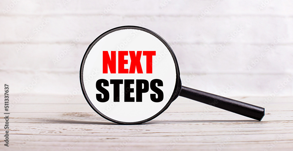 Poster the magnifying glass stands vertically on a light background with the text next steps
