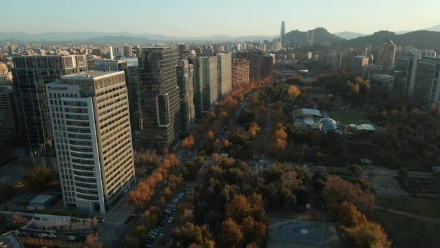 Aerial View Of Modern Buildings Of Las Condes District Near Araucano City Park In Santiago, Chile - drone shot