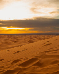 Fototapeta na wymiar Sunset over the dunes - Merzouga, Morocco