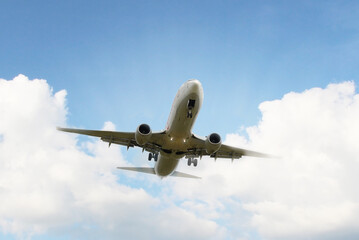 Fototapeta na wymiar Airplane taking off under beatiful cloudy sky