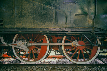 Vintage locomotive wheels at the station. 