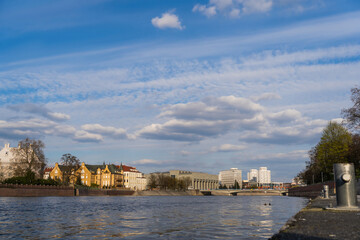Fototapeta premium Buildings near river and sky at background in Wroclaw