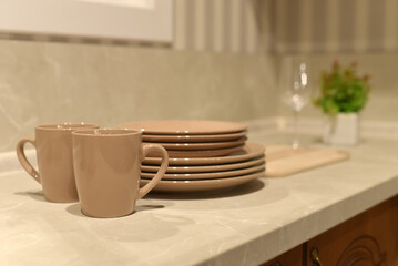 A set of dishes in the kitchen and cutlery