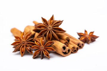 Star anise and cinnamon sticks on a white background isolated. Indian spices close up. Medicinal herbs and spices.