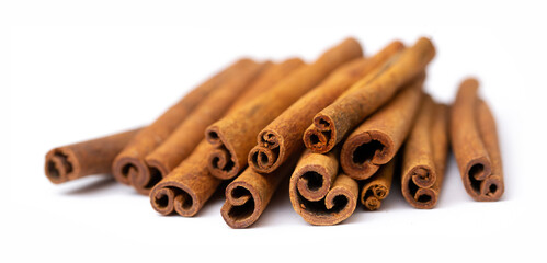 Cinnamon sticks on white background isolated. Indian spices close up. Medicinal herbs and spices.