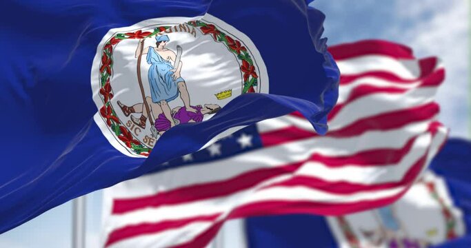 The Virginia state flag waving along with the national flag of the United States of America