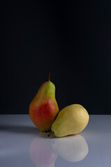 pears minimalistic still life on a dark background