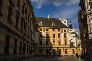 Old buildings with sunlight on urban street in Wroclaw
