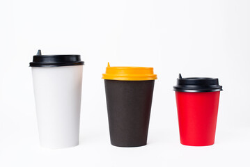 red, white and black paper cups on a white background