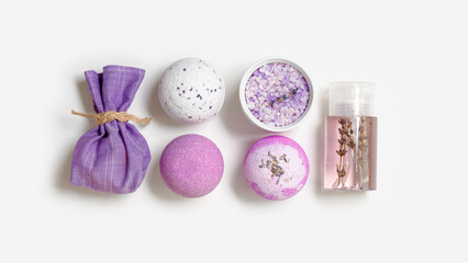 Obraz na płótnie Canvas Spa products with natural lavender essential oils, bath salt, scented bag, bath bombs, aroma water. Aromatherapy and herbal medicine, cosmetics for body treatment and good sleep