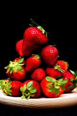 Fresh strawberries on black background