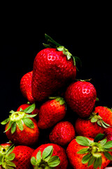 Fresh strawberries on black background