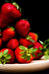 Fresh strawberries on black background