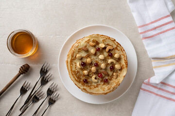 Big pancakes on the table, cooking delicious homemade pancakes