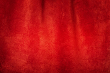 Red matte background of suede. Velvet texture of seamless leather. Red suede texture.