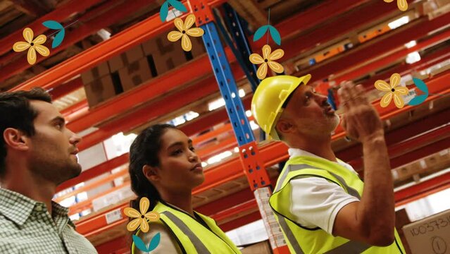 Animation of falling flowers over diverse group of warehouse workers