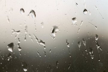 Abstract background with raindrops on glass, closeup