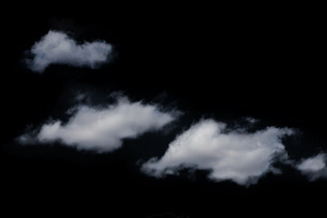 Obraz na płótnie Canvas white fluffy clouds isolated on a black background, clipart