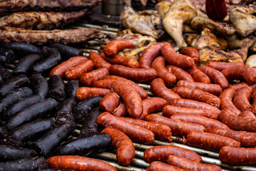 Large grill with sausages and black pudding cooked on the coals. Typical Argentine food.