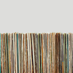 Stack of vinyl records. Listening to music from record. Playing music from analog disk. Retro and vintage. Audio stereo. Analog sound