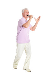 portrait of  senior man singing karaoke