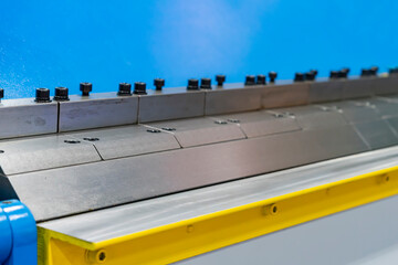 Close up upper teeth die or folding blade of manual bending machine for metal sheet or flat forming...