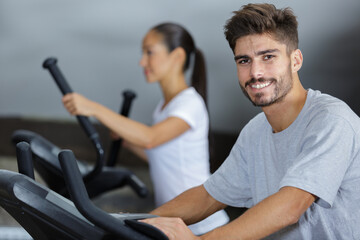 Fototapeta na wymiar happy man exercising in fitness