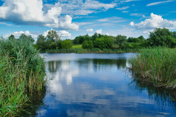 Summer landscape with river and blue sky, landscape with river and clouds