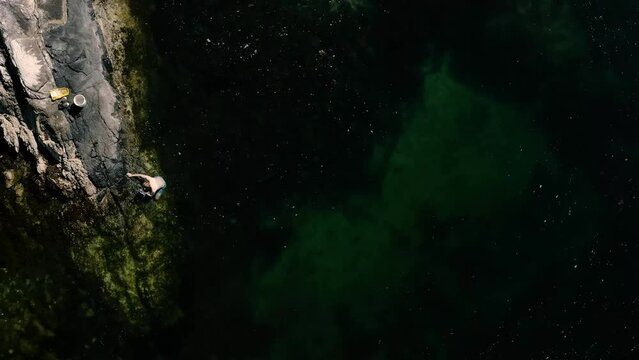 Top View Of People On The Rocky Shore Searching For Crabs On Sunshine Coast, Egmont BC Canada. Aerial Drone Shot