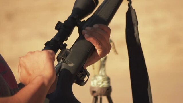 Reloading Weapon Close Up Slow Motion. Survive In Heat In The Desert.